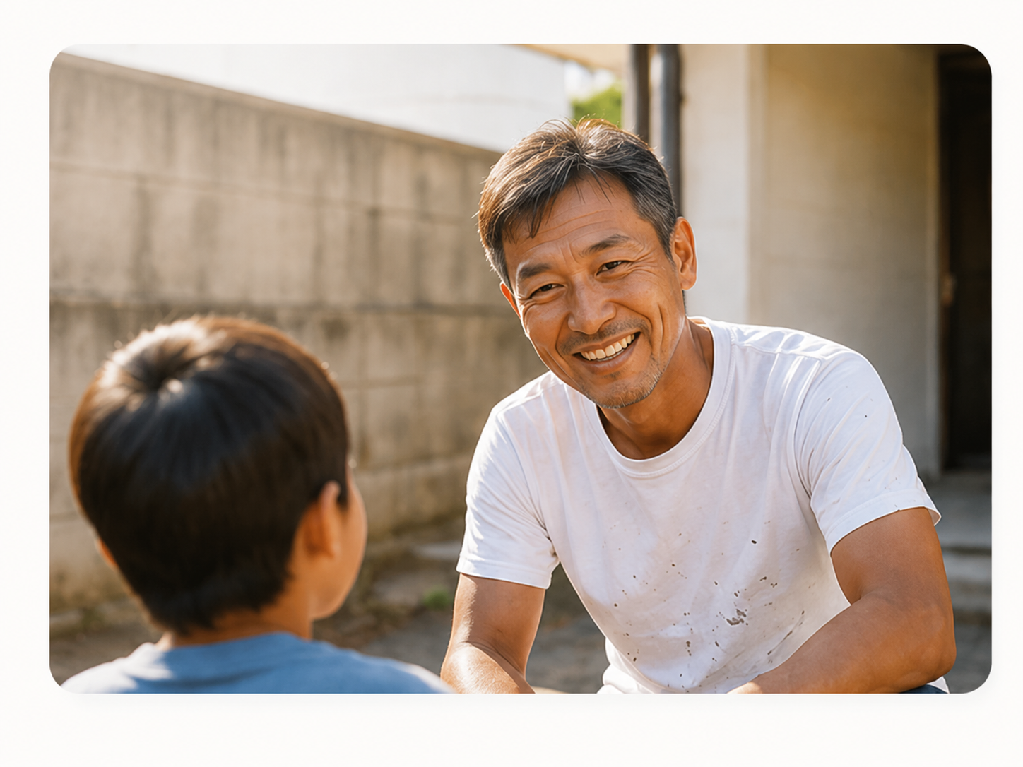 子どもと向き合って話す塗装スタッフ
